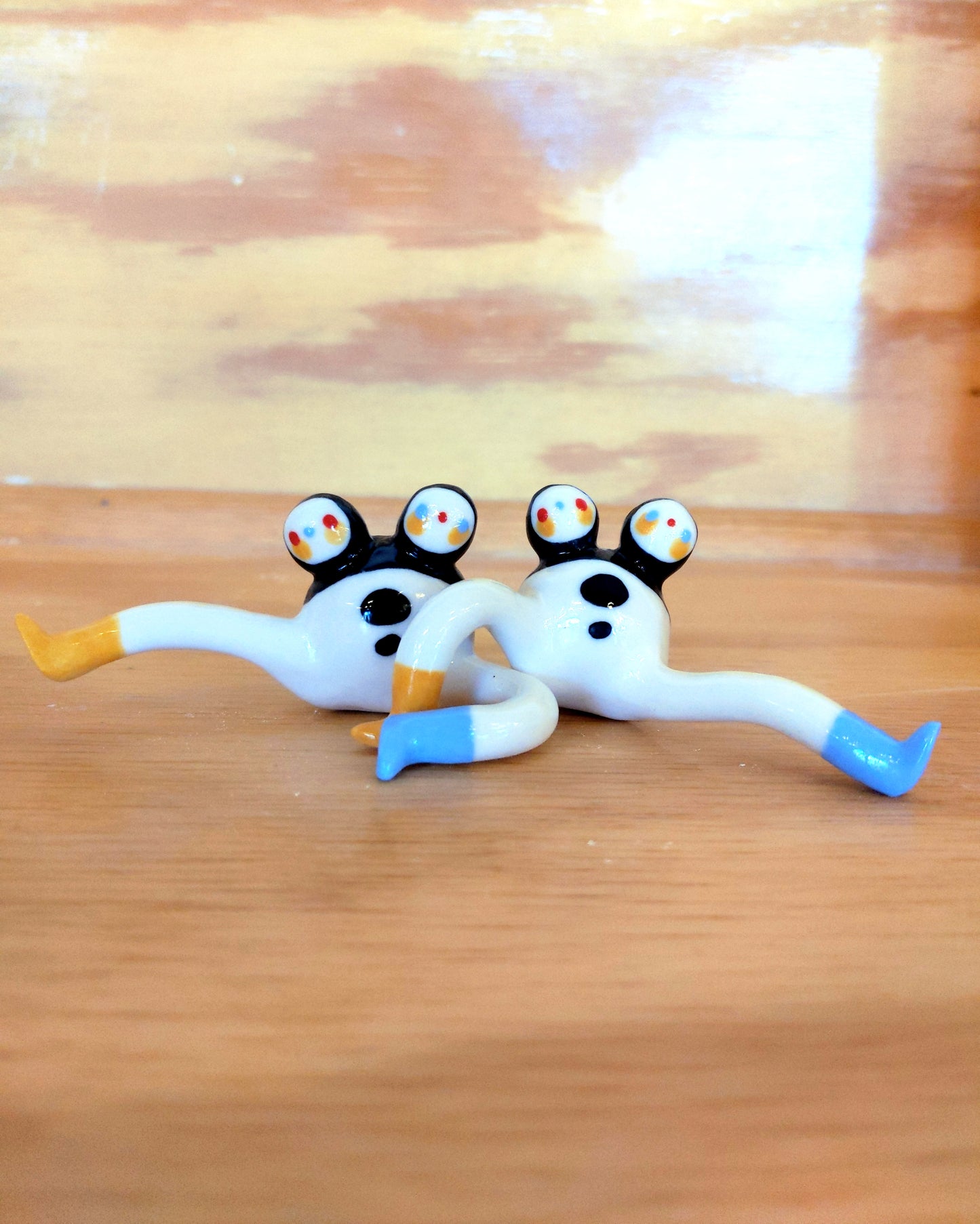 Tinybirdman Ceramic Art Toy [22.001 and 22.002: Two-Headed Tinybirdman with Inverse Right Face, Right Knee Up, Batch of Two]