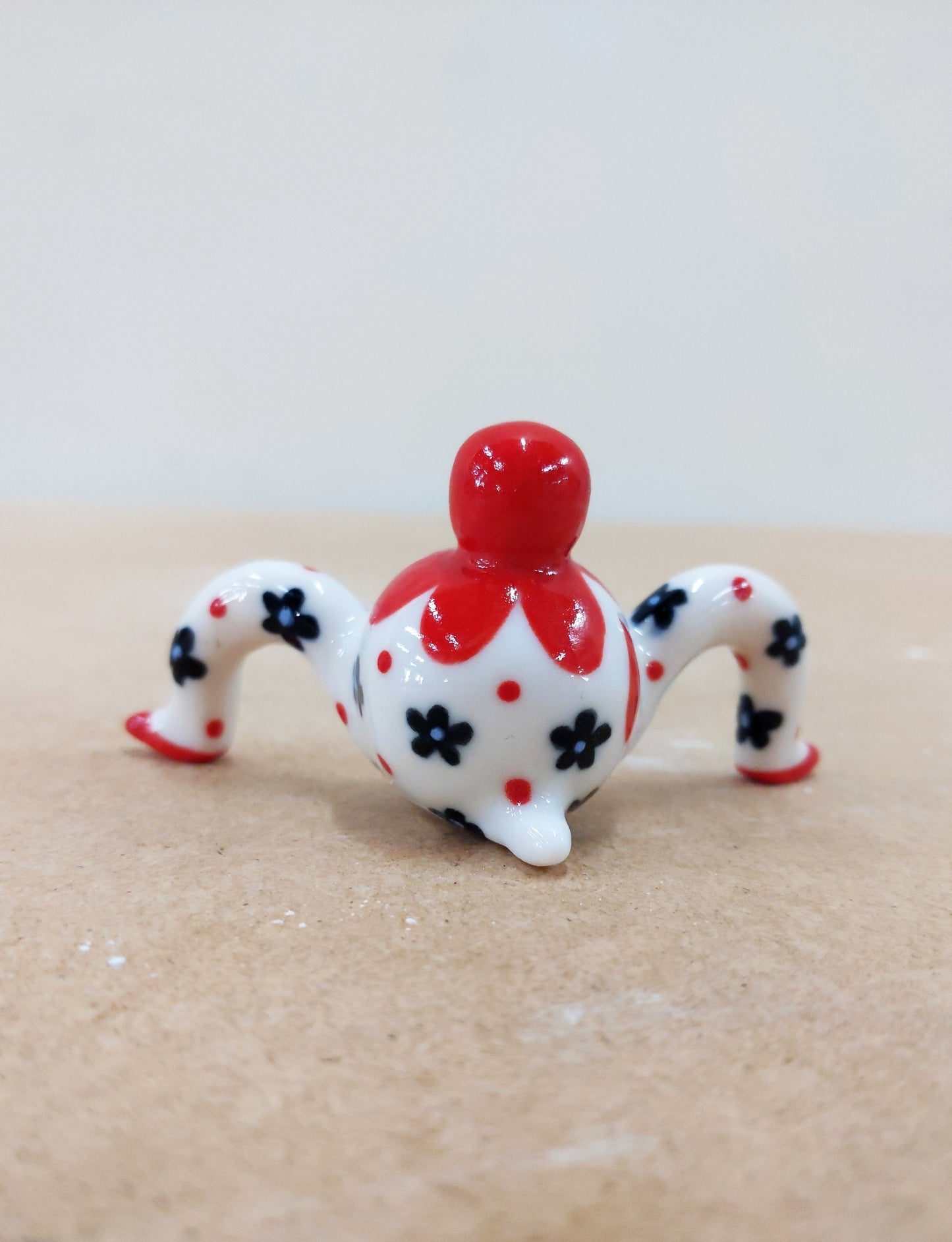 Tinybirdman Ceramic Art Toy [22.064: Red Flower Matryoshka with Falling Petal]