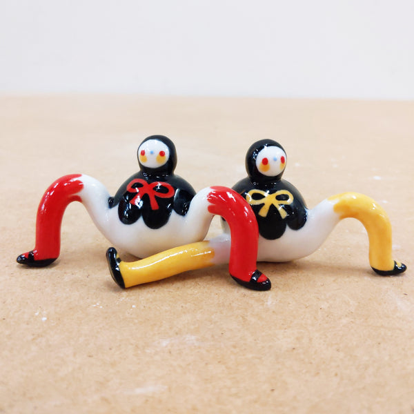 Tinybirdman Ceramic Art Toy Duo [22.053 and 22.054: Black Capelet with Bow, Red and Yellow]