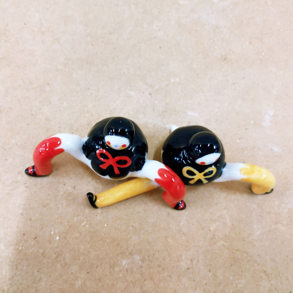 Tinybirdman Ceramic Art Toy Duo [22.053 and 22.054: Black Capelet with Bow, Red and Yellow]
