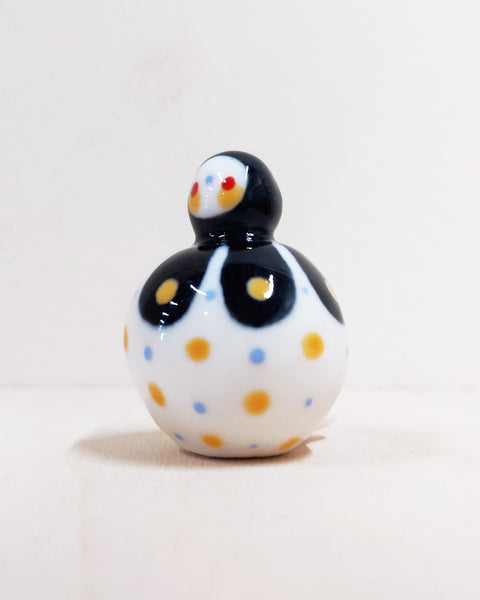 Birbauble Ceramic Art Toy [BB22.026: Black Flower with Blue and Yellow Spots, Red Heart Butt]