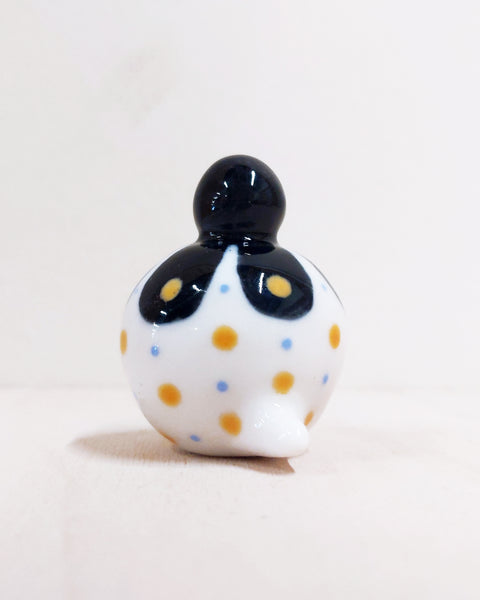 Birbauble Ceramic Art Toy [BB22.026: Black Flower with Blue and Yellow Spots, Red Heart Butt]