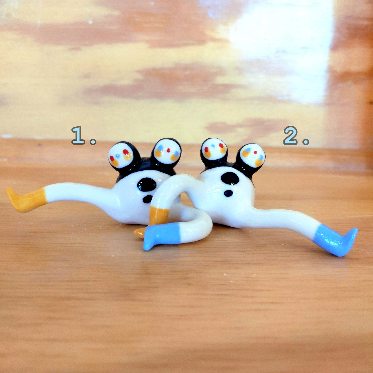 Tinybirdman Ceramic Art Toy [22.001 and 22.002: Two-Headed Tinybirdman with Inverse Right Face, Right Knee Up, Batch of Two]